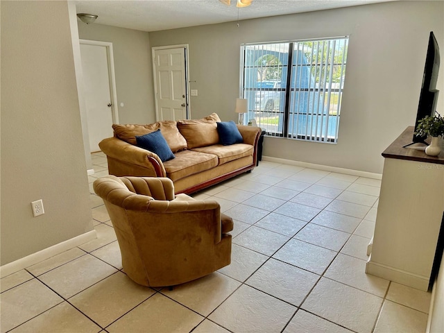 2270 Amherst Ave, Spring Hill, FL 34609 - living area featuring light tile patterned floors, baseboards, and ceiling fan