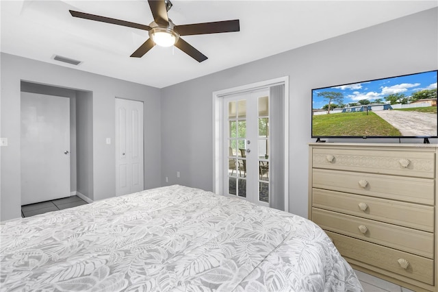 2270 Amherst Ave, Spring Hill, FL 34609 - bedroom featuring french doors, tile patterned flooring, and ceiling fan
