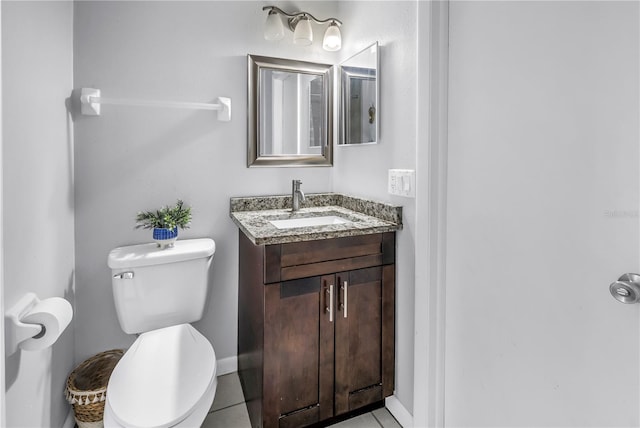 2270 Amherst Ave, Spring Hill, FL 34609 - bathroom with toilet, vanity, and baseboards