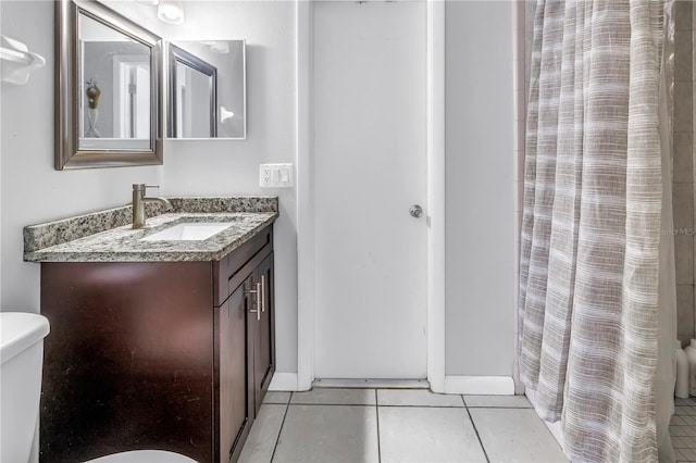 2270 Amherst Ave, Spring Hill, FL 34609 - bathroom featuring toilet, tile patterned floors, vanity, and a shower with shower curtain