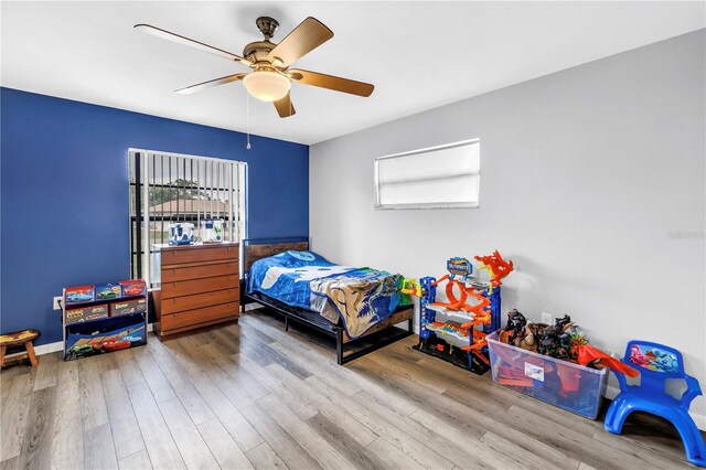 2270 Amherst Ave, Spring Hill, FL 34609 - bedroom with wood finished floors and ceiling fan
