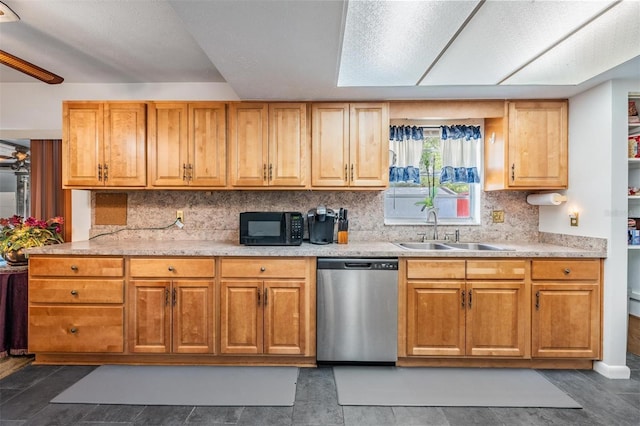 kitchen featuring dishwasher, a sink, black microwave, and light countertops