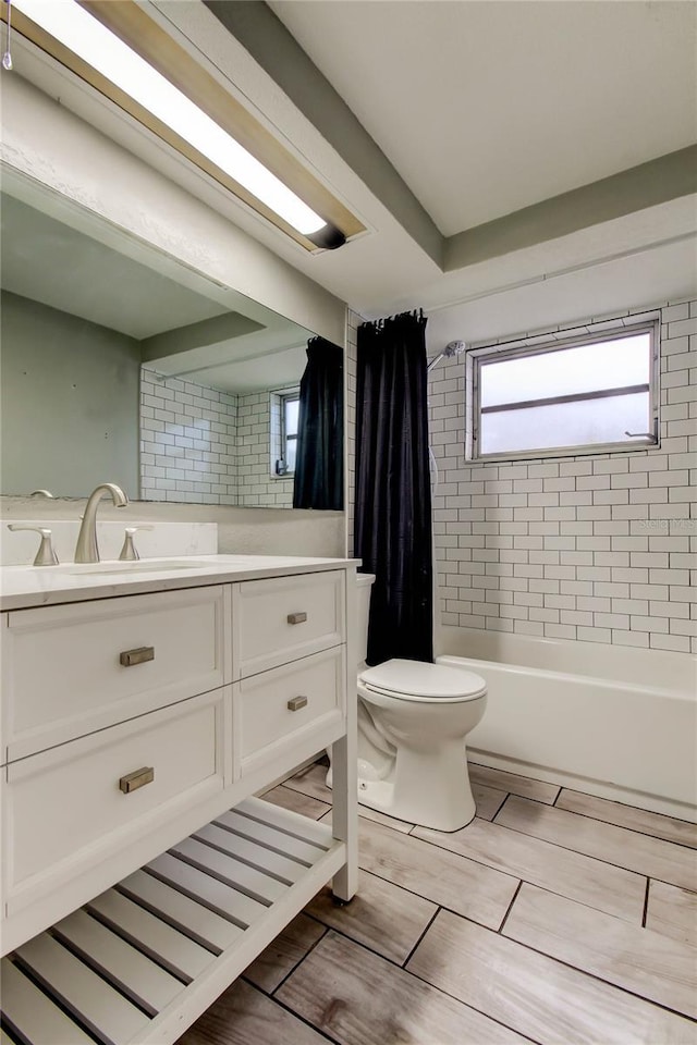 9120 Lunar Ln, Port Richey, FL 34668 - bathroom with toilet, vanity, and shower / bath combo