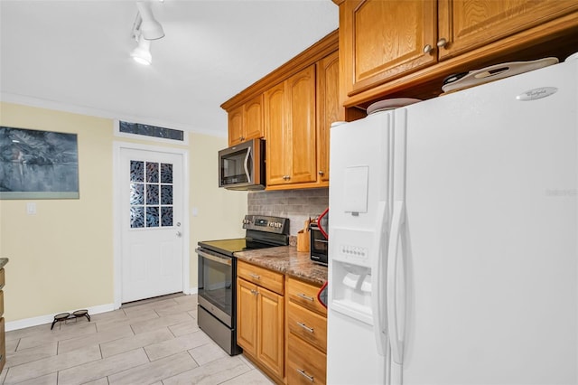 700 Bowsprit Pl, Palm Harbor, FL 34685 - kitchen with appliances with stainless steel finishes, backsplash, stone counters, brown cabinets, and baseboards