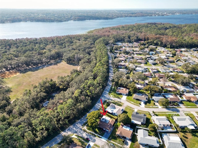 700 Bowsprit Pl, Palm Harbor, FL 34685 - aerial view of property's location featuring a forest, a nearby body of water, and nearby suburban area