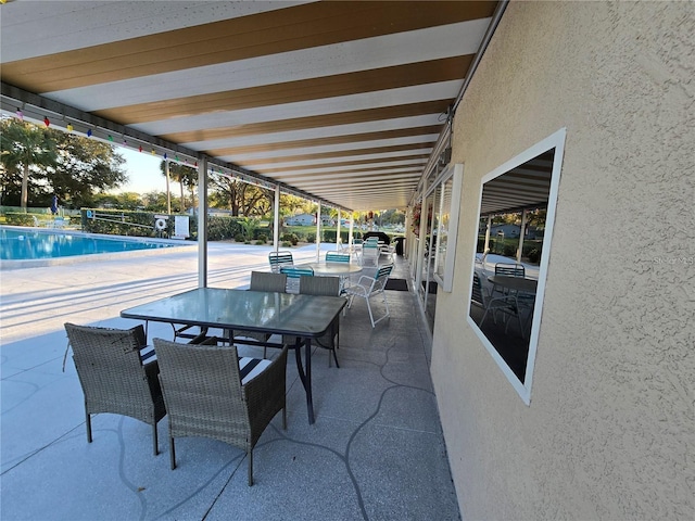 700 Bowsprit Pl, Palm Harbor, FL 34685 - view of patio featuring outdoor dining space and a community pool