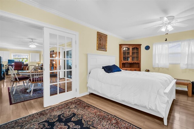 700 Bowsprit Pl, Palm Harbor, FL 34685 - bedroom with ornamental molding, wood finished floors, and a ceiling fan