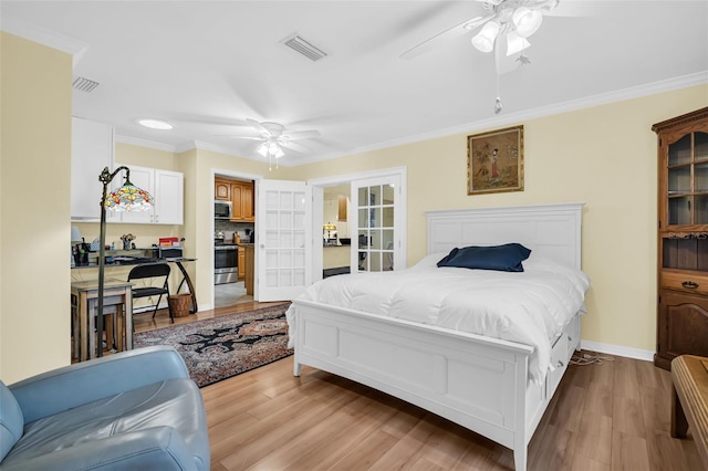 700 Bowsprit Pl, Palm Harbor, FL 34685 - bedroom with french doors, light wood-style floors, crown molding, a ceiling fan, and baseboards