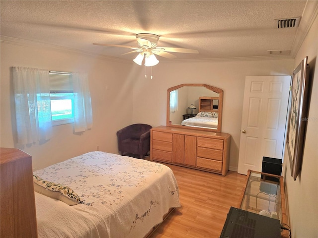 700 Bowsprit Pl, Palm Harbor, FL 34685 - bedroom featuring ornamental molding, a textured ceiling, light wood-style floors, ceiling fan, and arched walkways