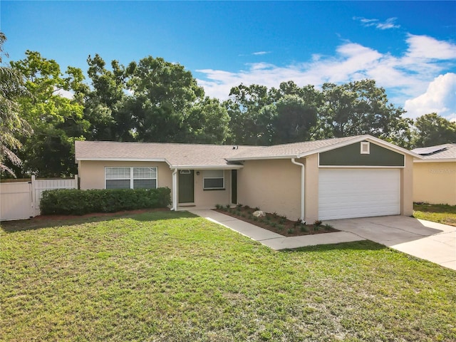 single story home with stucco siding, a garage, and driveway