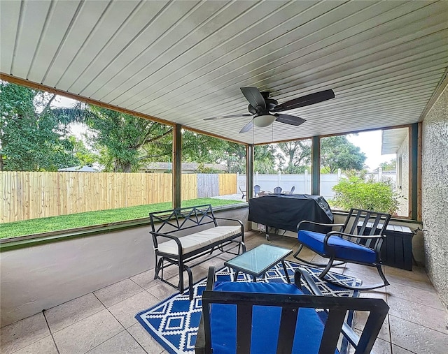 view of patio featuring a fenced backyard, ceiling fan, area for grilling, and an outdoor hangout area