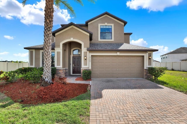 10106 Count Fleet Dr, Ruskin, FL 33575 - view of front of home featuring stucco siding, decorative driveway, an attached garage, and stone siding