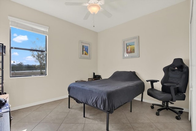 10106 Count Fleet Dr, Ruskin, FL 33575 - bedroom featuring baseboards, light tile patterned floors, and a ceiling fan