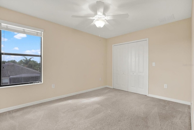 10106 Count Fleet Dr, Ruskin, FL 33575 - unfurnished bedroom featuring carpet floors, a closet, baseboards, and ceiling fan