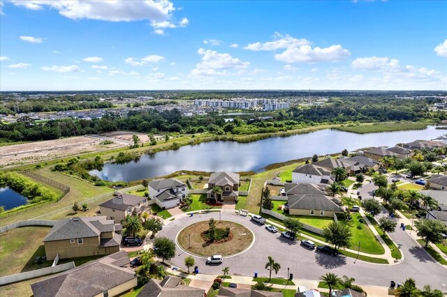 10106 Count Fleet Dr, Ruskin, FL 33575 - aerial view of residential area with a large body of water and a tree filled landscape