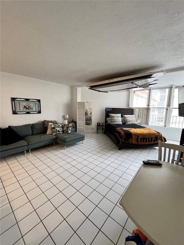 16400 Gulf Blvd Unit 307, North Redington Beach, FL 33708 - living area featuring light tile patterned floors and a textured ceiling