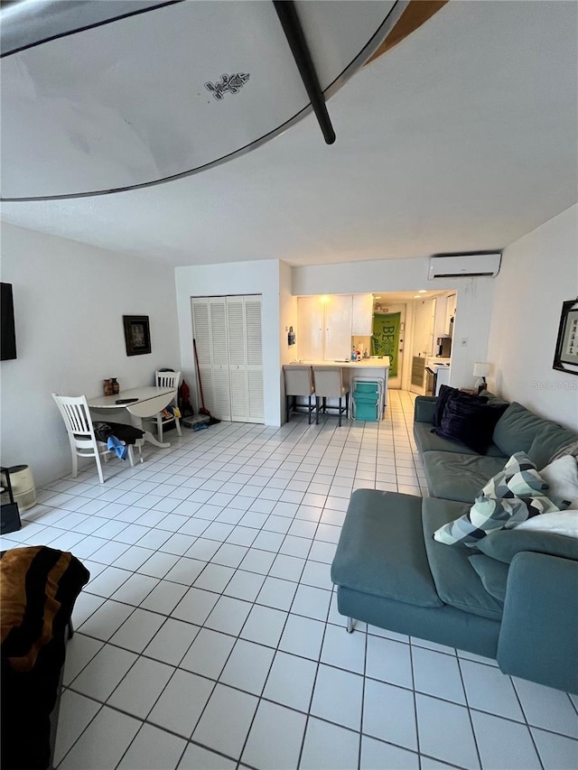 16400 Gulf Blvd Unit 307, North Redington Beach, FL 33708 - living area featuring a wall mounted AC and light tile patterned floors