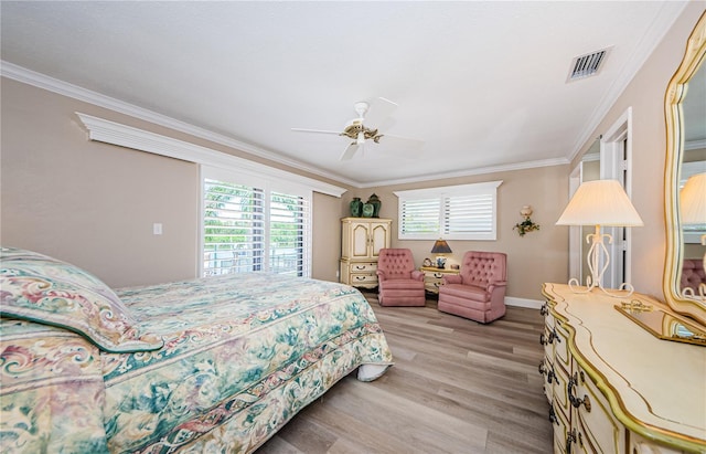 671 Tallahassee Dr NE, Saint Petersburg, FL 33702 - bedroom with light wood finished floors, crown molding, baseboards, and a ceiling fan