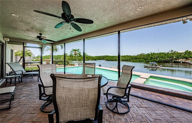 671 Tallahassee Dr NE, Saint Petersburg, FL 33702 - sunroom / solarium featuring a water view and a hot tub