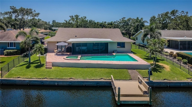 671 Tallahassee Dr NE, Saint Petersburg, FL 33702 - rear view of house with a water view, a patio, a sunroom, and a pool with connected hot tub