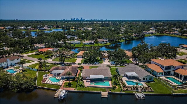 671 Tallahassee Dr NE, Saint Petersburg, FL 33702 - aerial perspective of suburban area featuring a pool and a large body of water