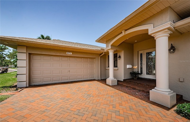 671 Tallahassee Dr NE, Saint Petersburg, FL 33702 - garage featuring decorative driveway