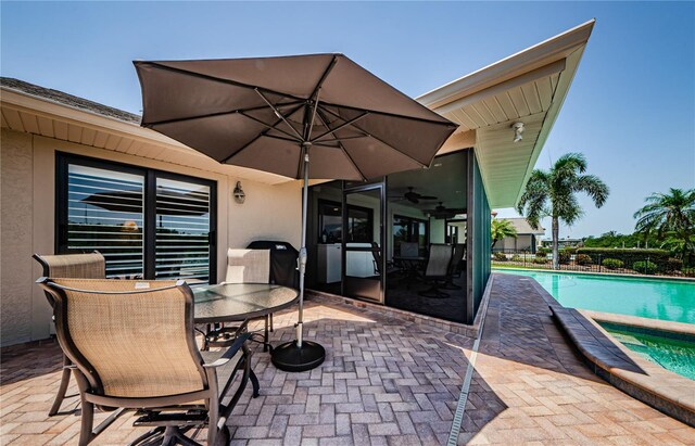 671 Tallahassee Dr NE, Saint Petersburg, FL 33702 - view of patio with an outdoor pool and outdoor dining space
