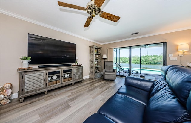 671 Tallahassee Dr NE, Saint Petersburg, FL 33702 - living room featuring crown molding, wood finished floors, baseboards, and ceiling fan