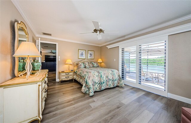 671 Tallahassee Dr NE, Saint Petersburg, FL 33702 - bedroom featuring wood finished floors, ornamental molding, access to exterior, a ceiling fan, and baseboards