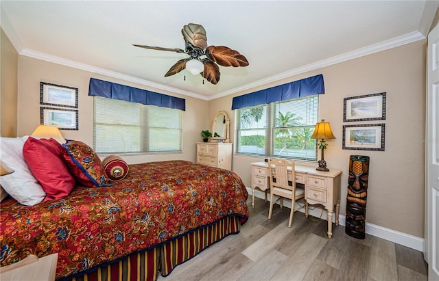 671 Tallahassee Dr NE, Saint Petersburg, FL 33702 - bedroom with wood finished floors, baseboards, crown molding, and a ceiling fan