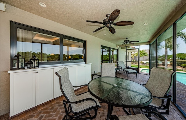 671 Tallahassee Dr NE, Saint Petersburg, FL 33702 - sunroom / solarium featuring ceiling fan and outdoor dining area
