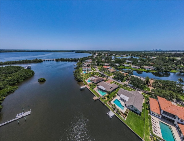 671 Tallahassee Dr NE, Saint Petersburg, FL 33702 - aerial view of residential area featuring a nearby body of water and a pool area