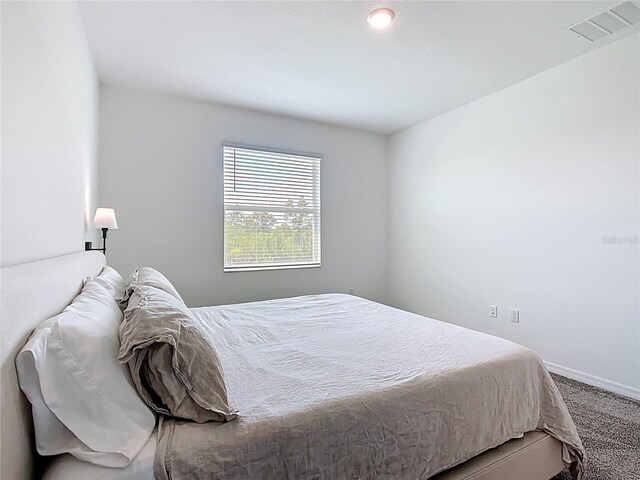 800 Reggie Rd, Winter Haven, FL 33884 - carpeted bedroom with baseboards