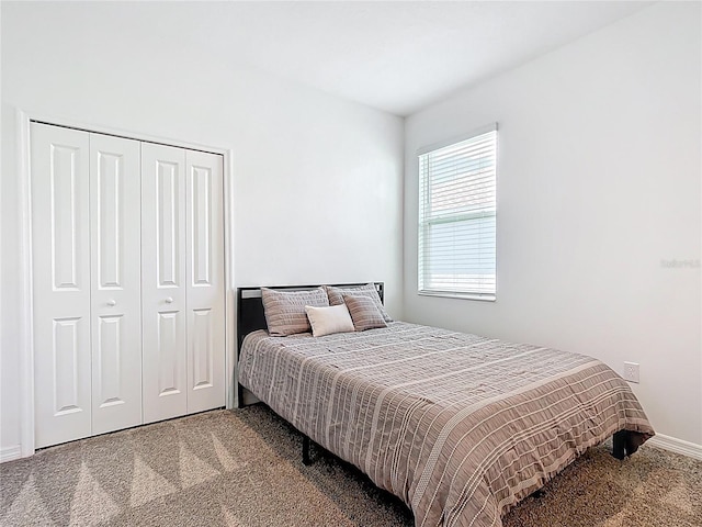 800 Reggie Rd, Winter Haven, FL 33884 - carpeted bedroom featuring a closet and baseboards