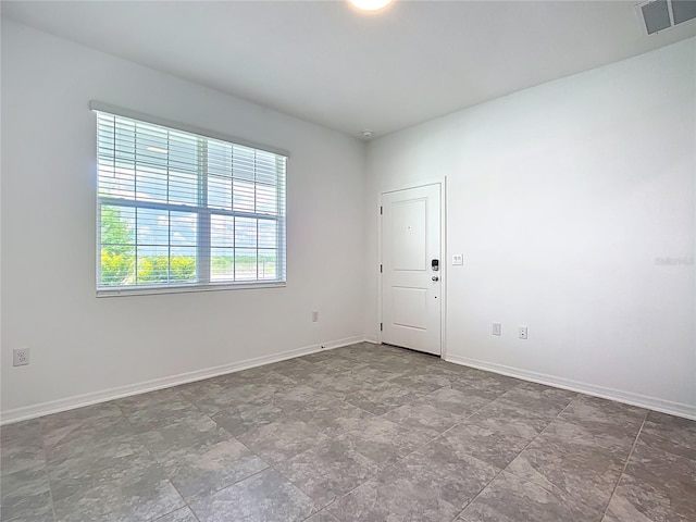 800 Reggie Rd, Winter Haven, FL 33884 - unfurnished room with baseboards and stone finish flooring
