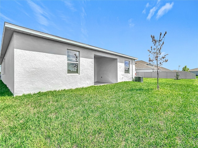 800 Reggie Rd, Winter Haven, FL 33884 - back of house featuring stucco siding and cooling unit