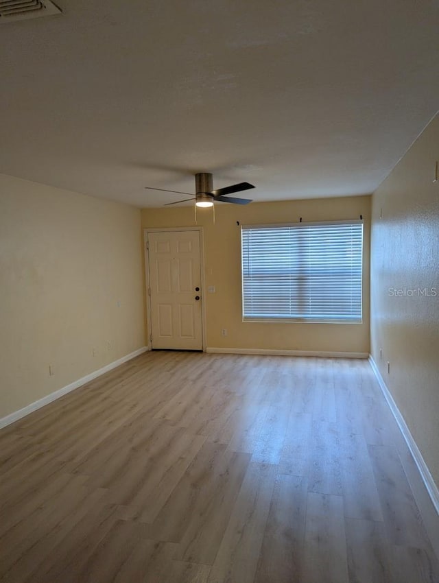 5915 Brickleberry Ln Unit 103, Zephyrhills, FL 33541 - unfurnished room with wood finished floors, ceiling fan, and baseboards