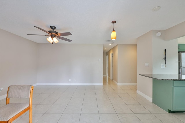 13125 Wilcox Rd Unit 16202, Largo, FL 33774 - unfurnished living room featuring a ceiling fan, light tile patterned floors, and baseboards