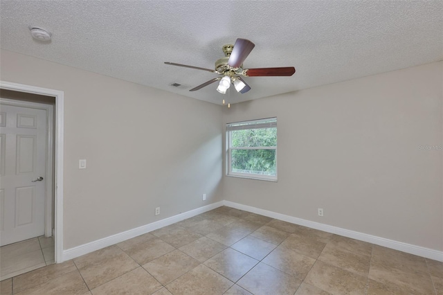 13125 Wilcox Rd Unit 16202, Largo, FL 33774 - empty room with a smoke detector, light tile patterned floors, ceiling fan, a textured ceiling, and baseboards