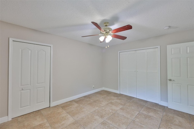 13125 Wilcox Rd Unit 16202, Largo, FL 33774 - unfurnished bedroom with a textured ceiling, baseboards, and ceiling fan