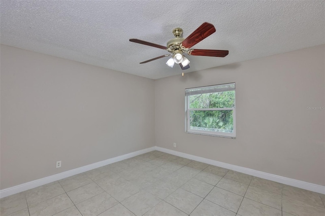 13125 Wilcox Rd Unit 16202, Largo, FL 33774 - empty room featuring a ceiling fan, a textured ceiling, baseboards, and light tile patterned floors