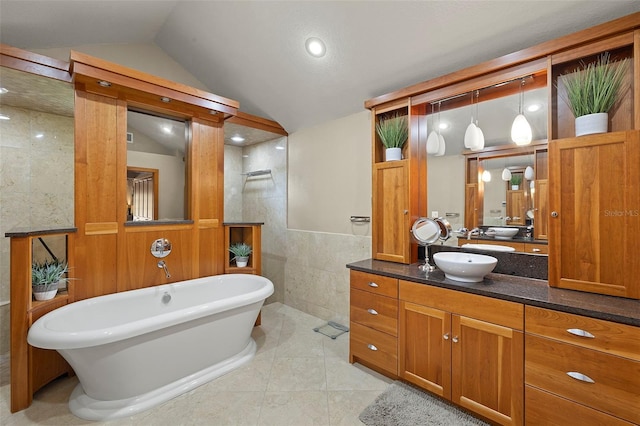 3922 Cedar Cay Cir, Valrico, FL 33596 - bathroom featuring tile walls, vanity, a walk in shower, a soaking tub, and vaulted ceiling