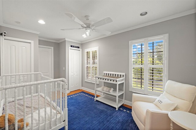 3922 Cedar Cay Cir, Valrico, FL 33596 - bedroom with wood finished floors, baseboards, recessed lighting, ornamental molding, and a ceiling fan