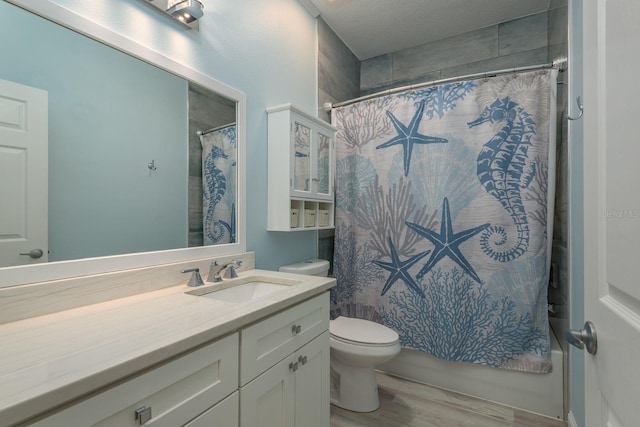 632 S Florida Ave, Tarpon Springs, FL 34689 - bathroom featuring wood finished floors, toilet, and a shower with shower curtain