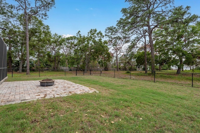 632 S Florida Ave, Tarpon Springs, FL 34689 - view of yard featuring an outdoor fire pit and a patio