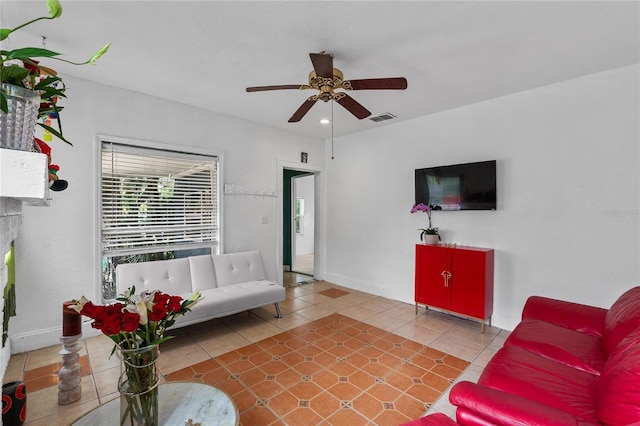 536 Ave G SE, Winter Haven, FL 33880 - tiled living room with a ceiling fan and baseboards