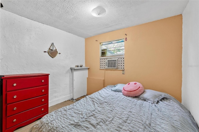 536 Ave G SE, Winter Haven, FL 33880 - tiled bedroom featuring a textured ceiling and cooling unit