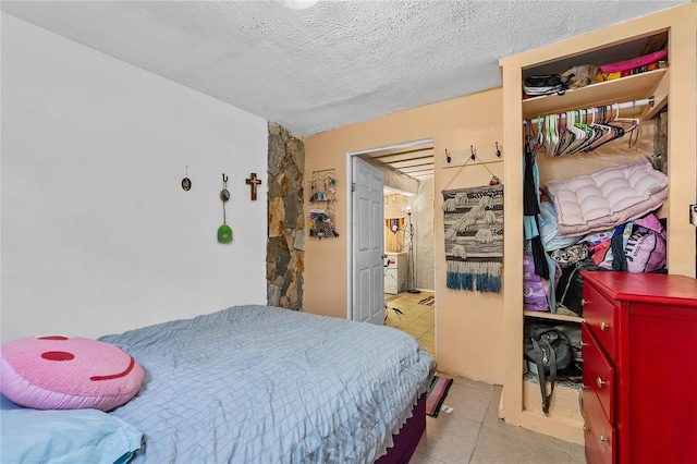 536 Ave G SE, Winter Haven, FL 33880 - bedroom with tile patterned floors and a textured ceiling