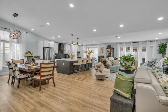332 Wood Dove Ave, Tarpon Springs, FL 34689 - living area with light wood-style flooring, recessed lighting, and a chandelier
