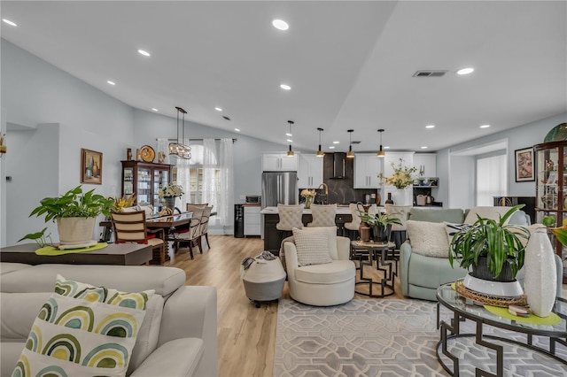 332 Wood Dove Ave, Tarpon Springs, FL 34689 - living area with recessed lighting, light wood-style floors, and vaulted ceiling